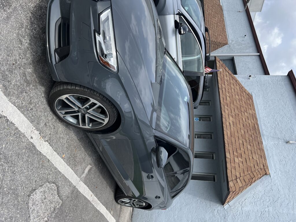 Car after collision repair with restored body and fresh paint