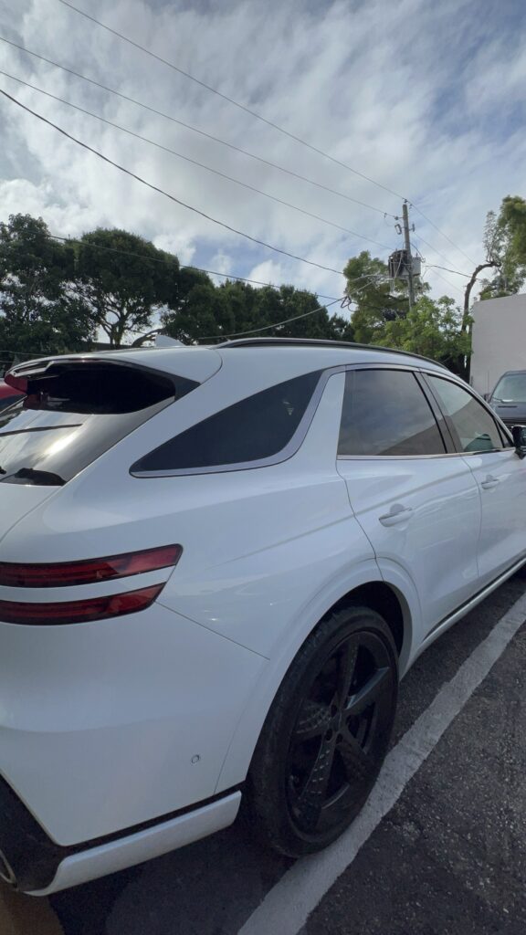 Car side panel fully repaired using aluminum welding and refinished with high-gloss paint and racing stripes