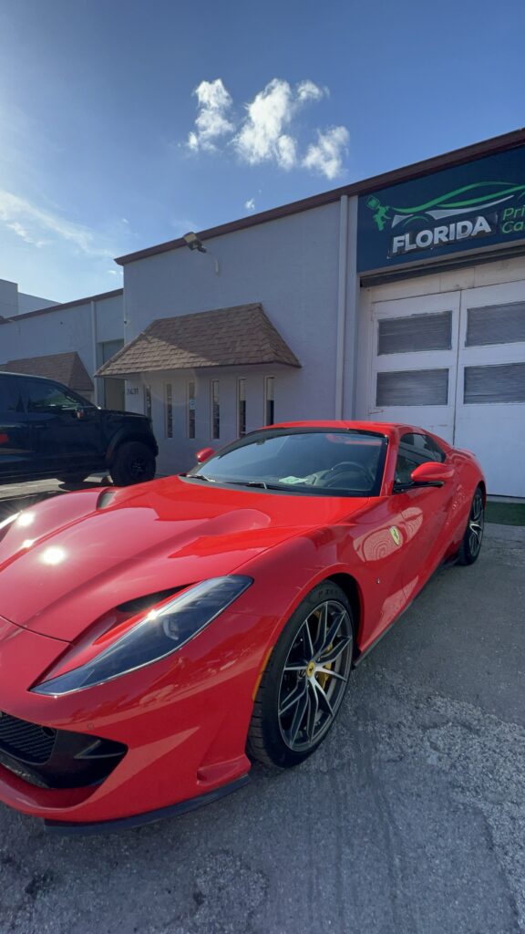 Ferrari car after collision repair with restored body and flawless paint finish